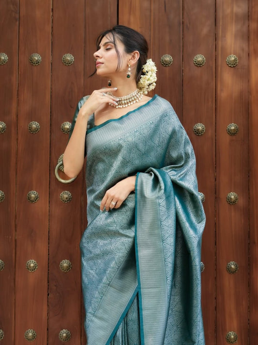 Attractive Firozi Color Banarasi Soft Silk Saree With Blouse Piece
