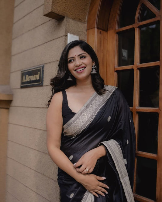 A glam Black Color Banarasi Soft Silk Saree With Blouse Piece