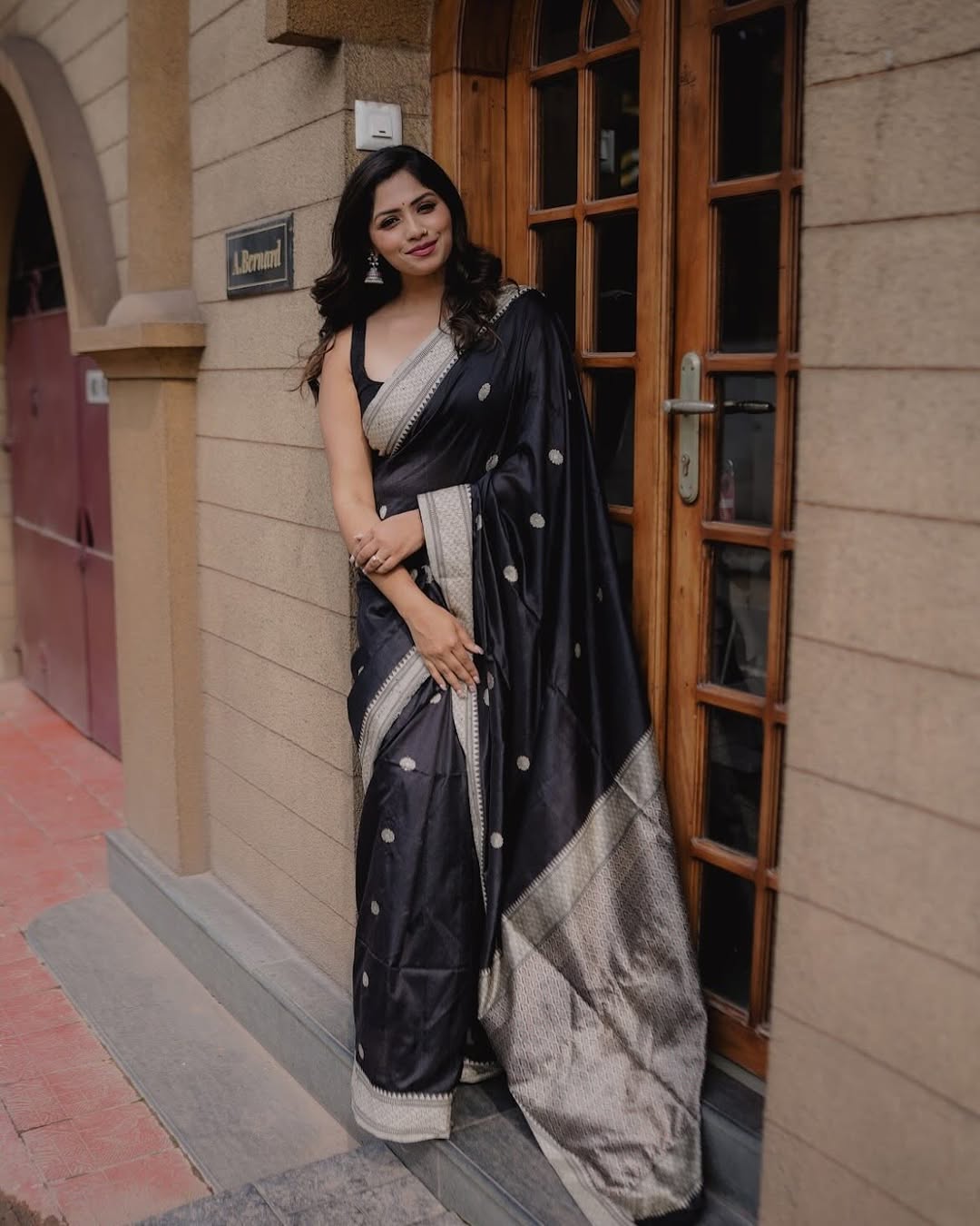 A glam Black Color Banarasi Soft Silk Saree With Blouse Piece