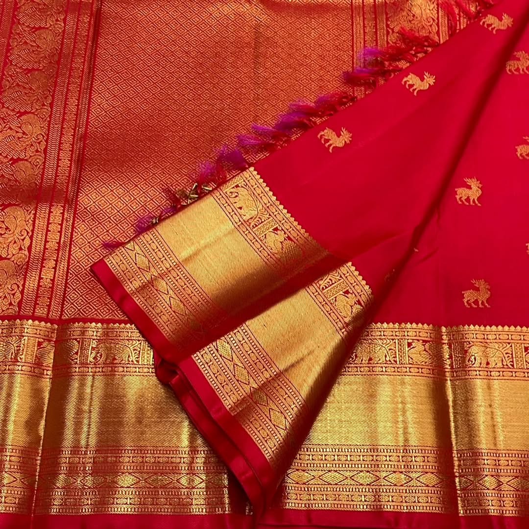 A glam Red Banarasi Soft Silk Saree With Blouse Piece