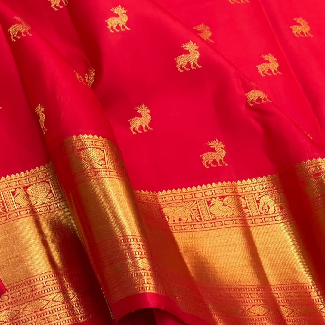 A glam Red Banarasi Soft Silk Saree With Blouse Piece