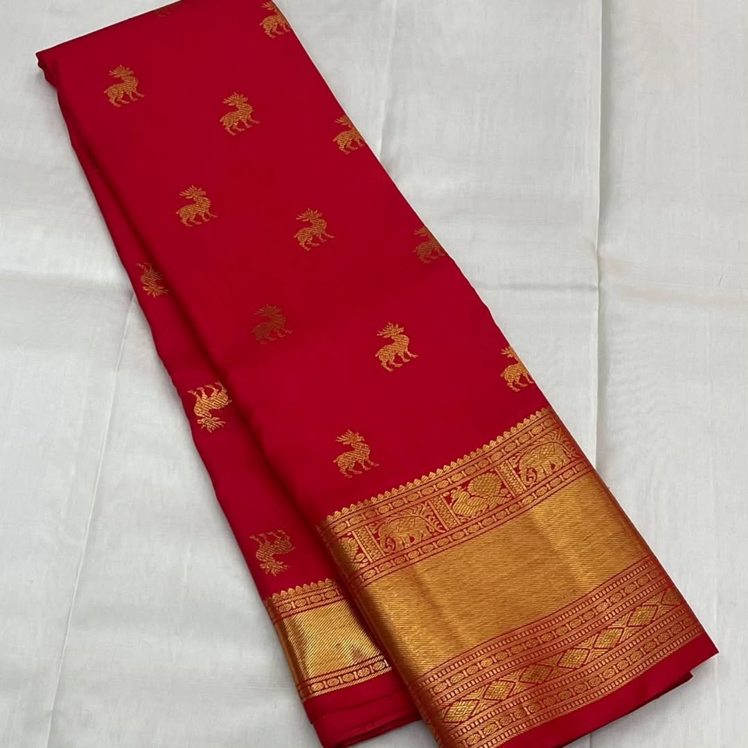 A glam Red Banarasi Soft Silk Saree With Blouse Piece